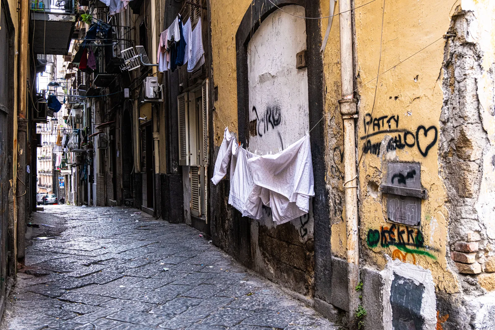 Narrow lanes and washing lines strung between buildings in the historic centre of Naples
