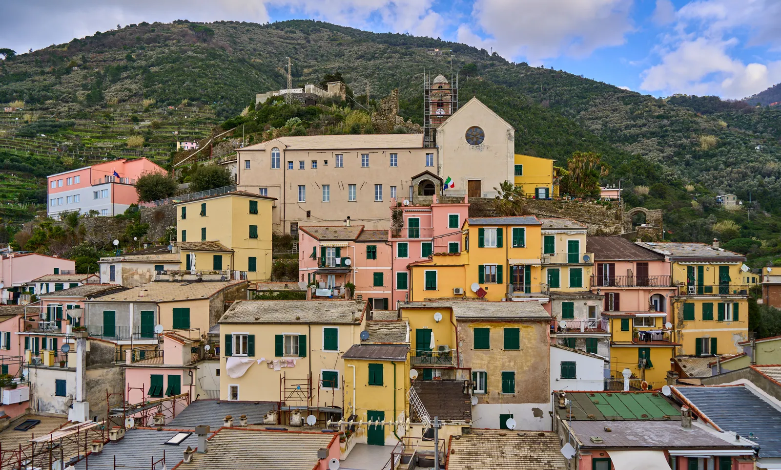 Pastel houses of a Cinque Terre village stacked above the Ligurian coast, Italy