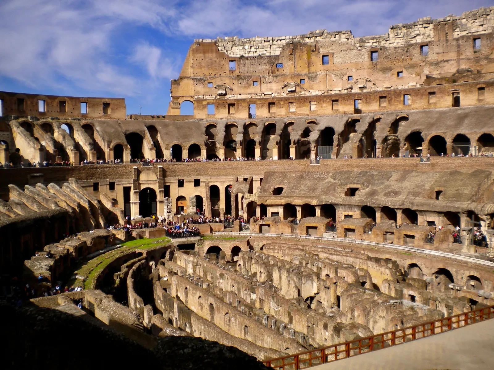 The tiered interior and exposed underground chambers of the Colosseum in Rome, Italy