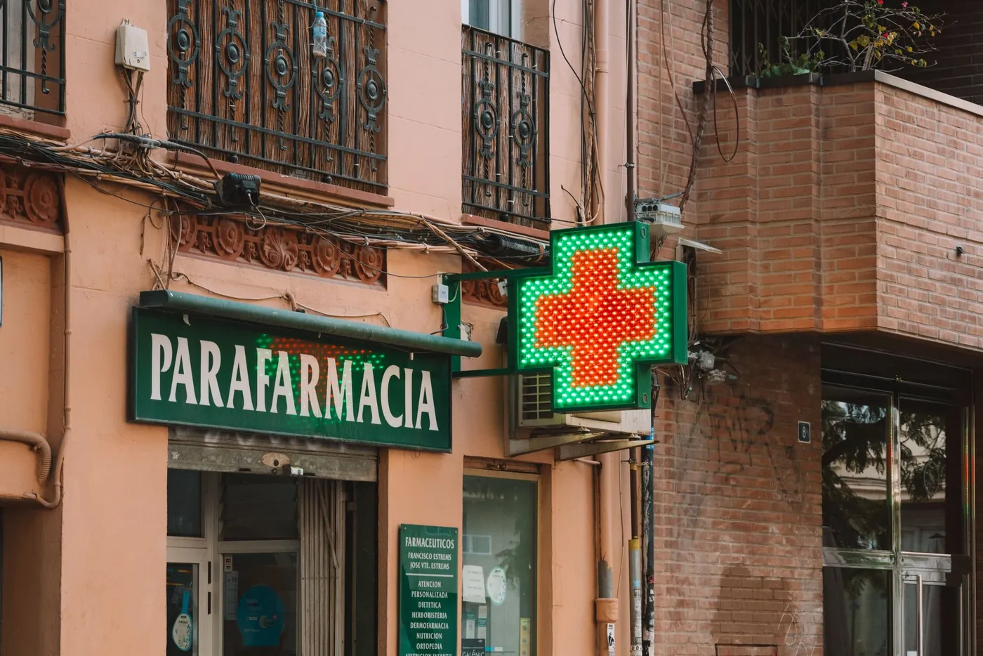 The historic entrance of a traditional Italian pharmacy with its old apothecary signage