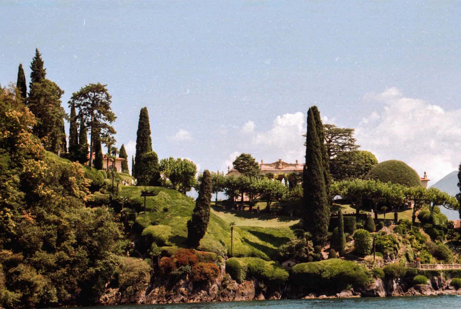 Terraced gardens and cypresses above the water on Lake Como, Italy