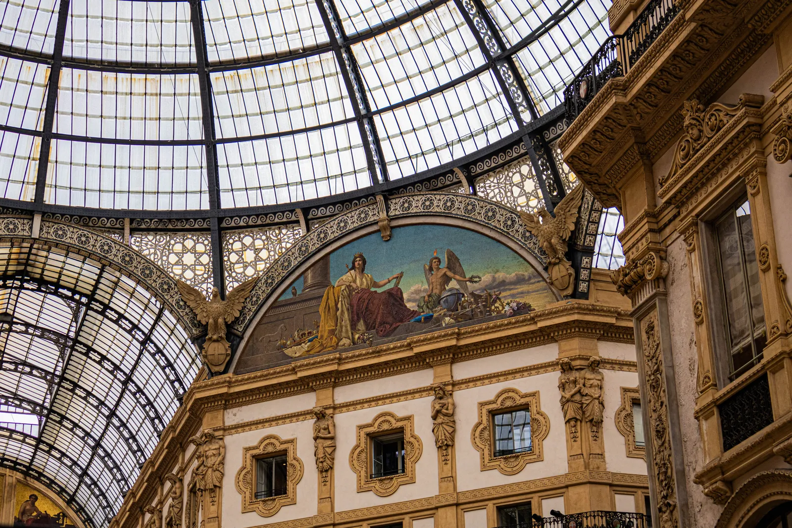 The glass-roofed shopping arcade beside Milan cathedral, Italy