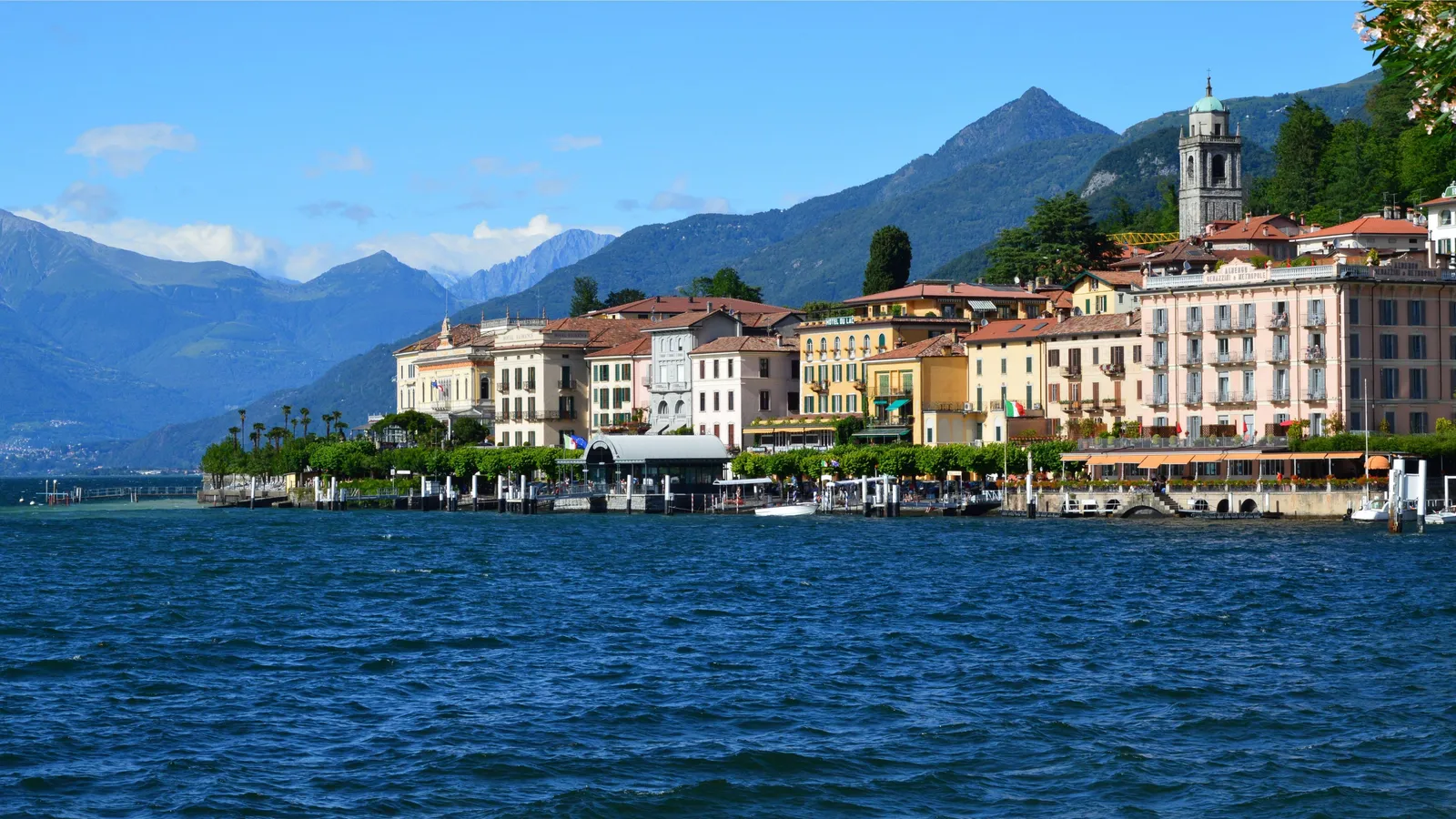 A lakeside town with mountains behind on Lake Como, Italy