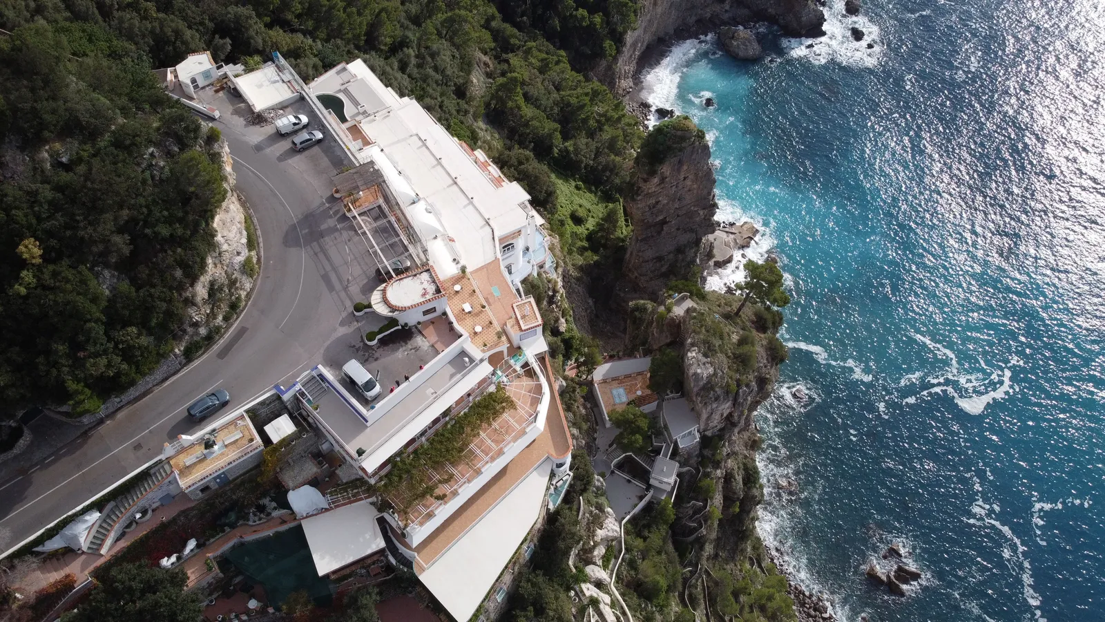 A hotel built into the cliff above the sea on the Amalfi Coast, Italy