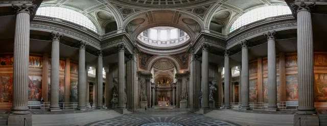 A vast concrete dome with a central opening above a round hall