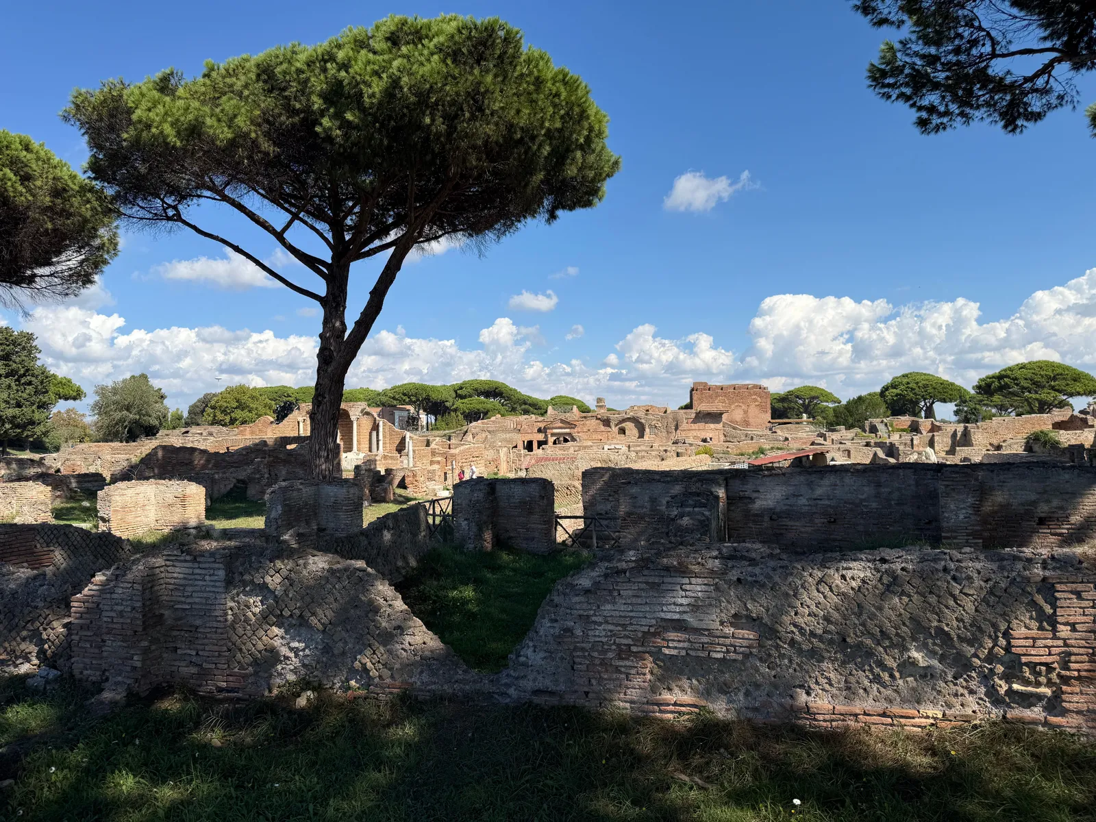 The paved streets and brick ruins of the Roman port town of Ostia Antica near Rome, Italy
