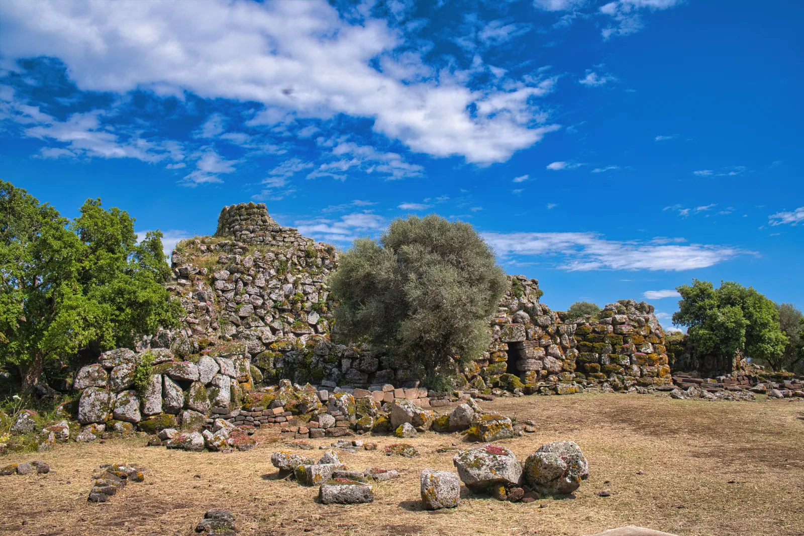One of Sardinia's ancient stone nuraghi towers standing in open countryside, Italy