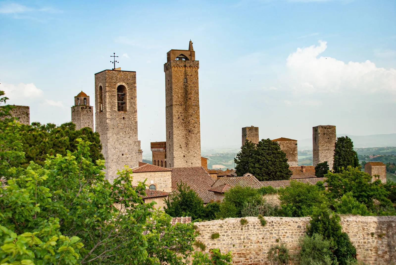 The medieval stone towers rising above the rooftops of San Gimignano, Italy