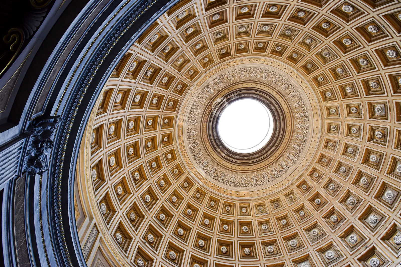The coffered dome and open oculus of the Pantheon interior in Rome, Italy