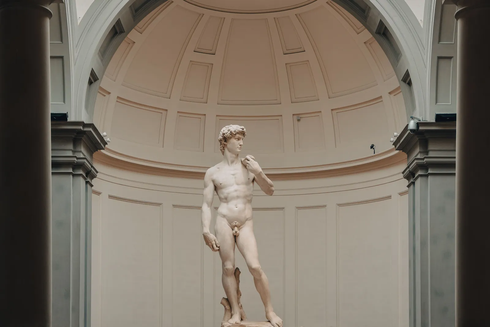 The statue of David standing under the domed skylight of the Accademia in Florence, Italy