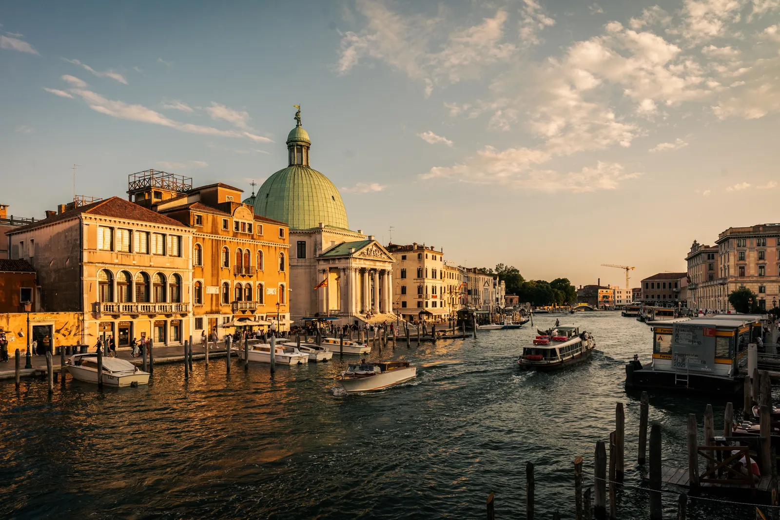 The Grand Canal in Venice glowing at golden hour, seen from the water